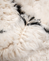 Modern, designer, handcrafted Berber rug from Morocco. Beniourain carpet with minimalist design, natural wool pile and a fluffy texture.
