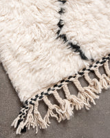 Modern, designer, handcrafted Berber rug from Morocco. Beniourain carpet with minimalist design, natural wool pile and a fluffy texture.