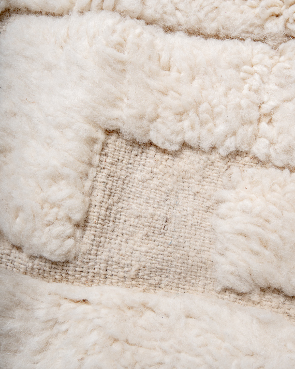 Modern, designer, handcrafted Berber rug from Morocco. Beniourain carpet with minimalist design, natural wool pile and a fluffy texture.