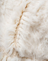 Modern, designer, handcrafted Berber rug from Morocco. Beniourain carpet with minimalist design, natural wool pile and a fluffy texture.