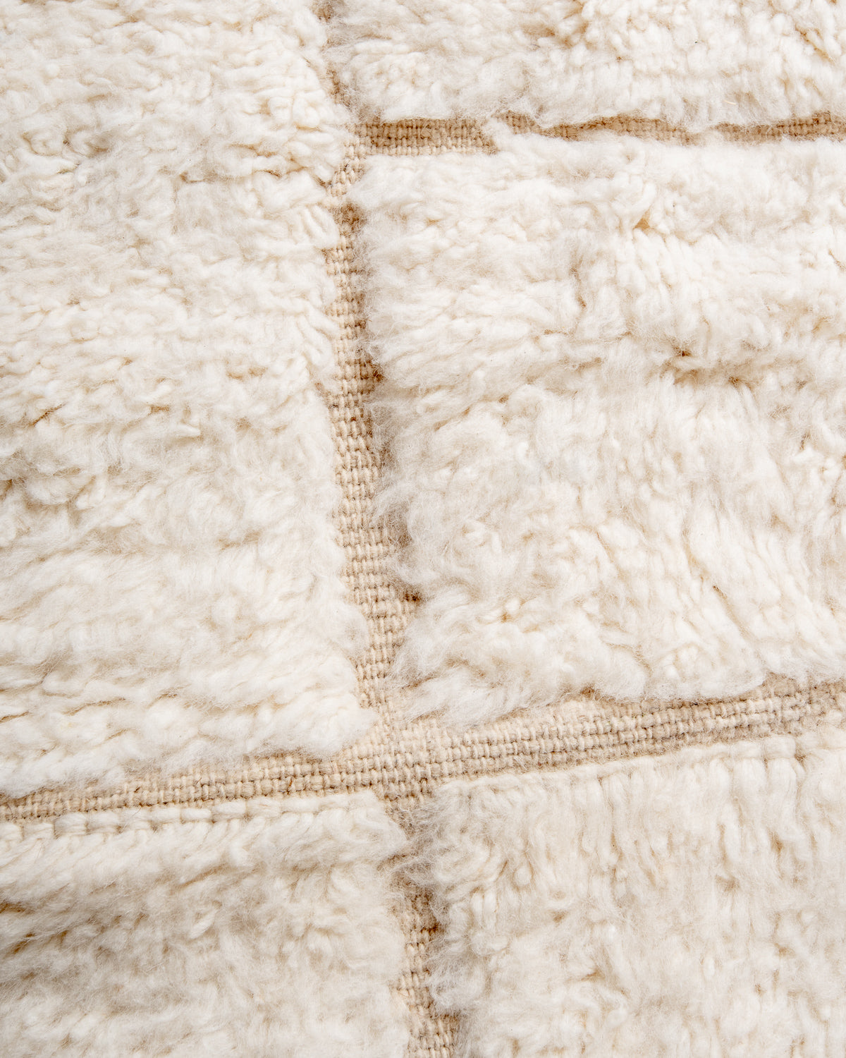 Modern, designer, handcrafted Berber rug from Morocco. Beniourain carpet with minimalist design, natural wool pile and a fluffy texture.
