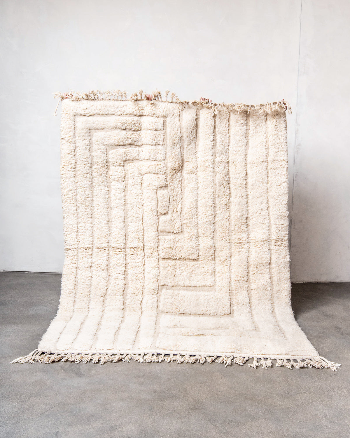 Modern, designer, handcrafted Berber rug from Morocco. Beniourain carpet with minimalist design, natural wool pile and a fluffy texture.