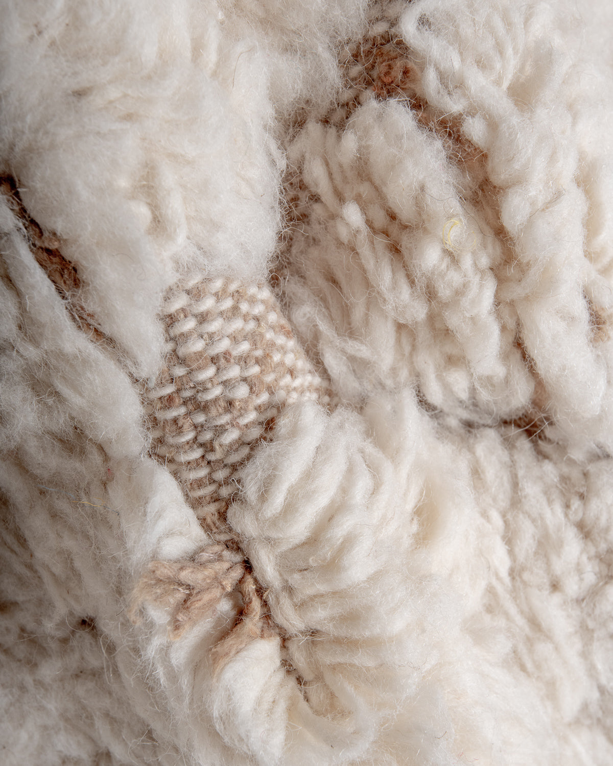 Modern, designer, handcrafted Berber rug from Morocco. Beniourain carpet with minimalist design, natural wool pile and a fluffy texture.