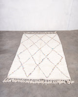 Modern, designer, handcrafted Berber rug from Morocco. Beniourain carpet with beautiful colours and patterns and fluffy wool texture.