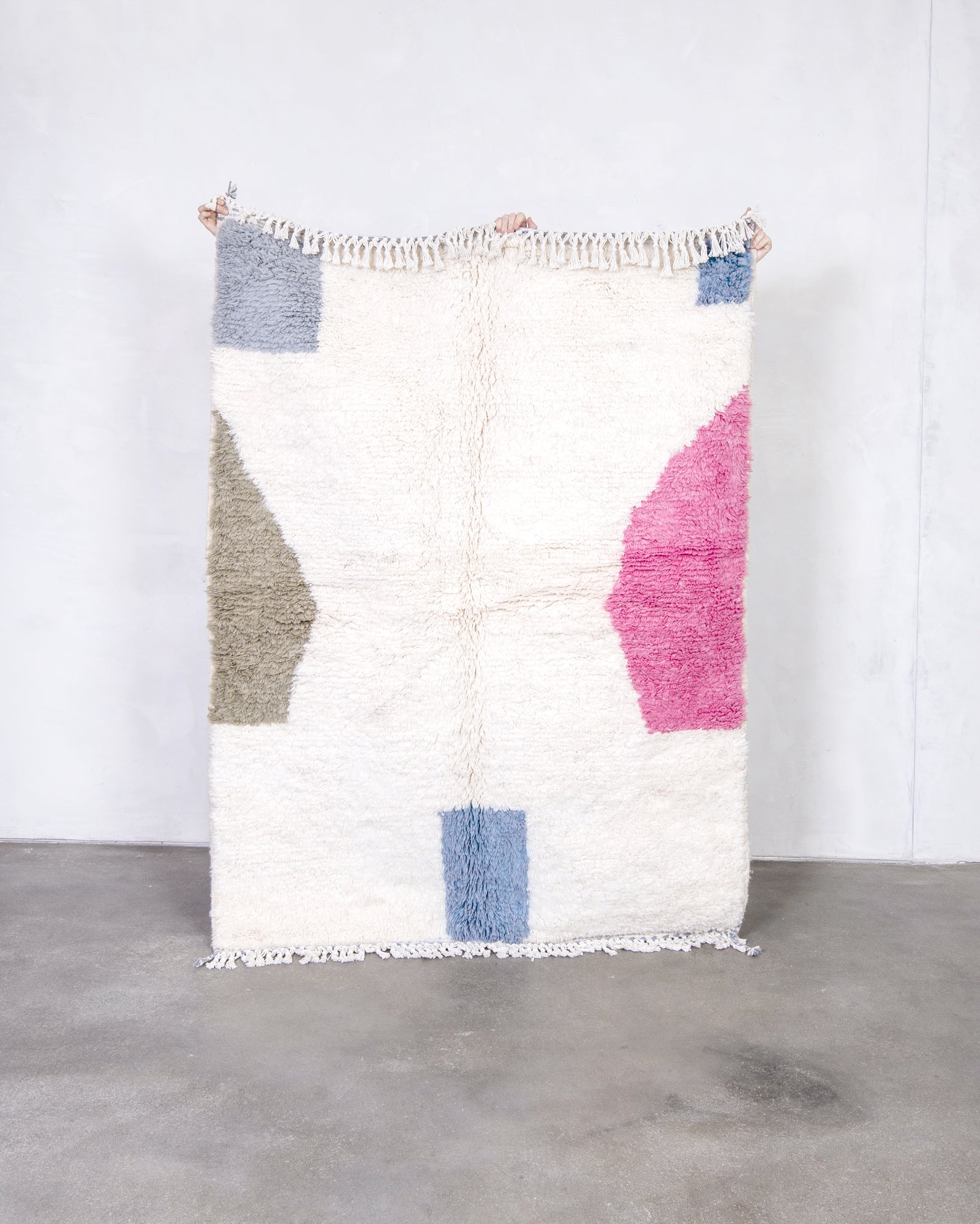 Modern, designer, handcrafted Berber rug from Morocco. Beniourain carpet with beautiful colors and patterns and fluffy wool texture.