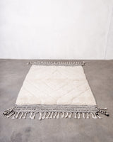 Modern, designer, handcrafted Berber rug from Morocco. Beniourain carpet with beautiful colours and patterns and fluffy wool texture.