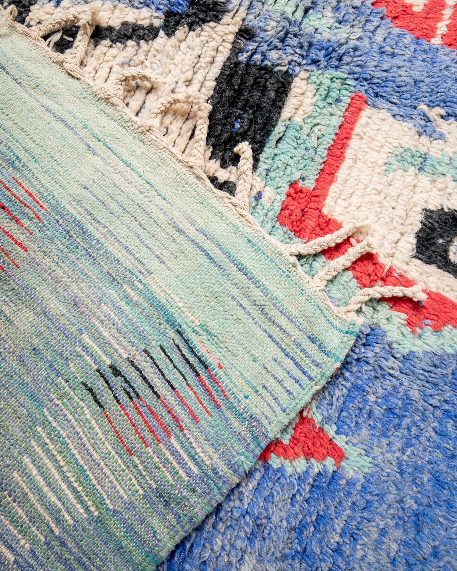 Modern, designer, handcrafted Berber rug from Morocco. Vintage carpet with beautiful colours and patterns and fluffy texture.