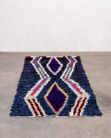Vintage, handcrafted Berber rug from Morocco. Boucherouite carpet with beautiful colours and patterns and heavy cotton texture.