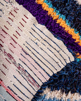 Vintage, handcrafted Berber rug from Morocco. Boucherouite carpet with beautiful colours and patterns and heavy cotton texture.