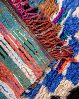 Modern designer handcrafted cotton Berber rug from Morocco. Boucherouite with beautiful colors and patterns.