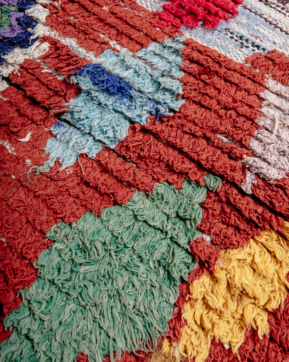 Modern designer vintage handcrafted cotton Berber rug from Morocco. Boucherouite with beautiful colors and patterns.