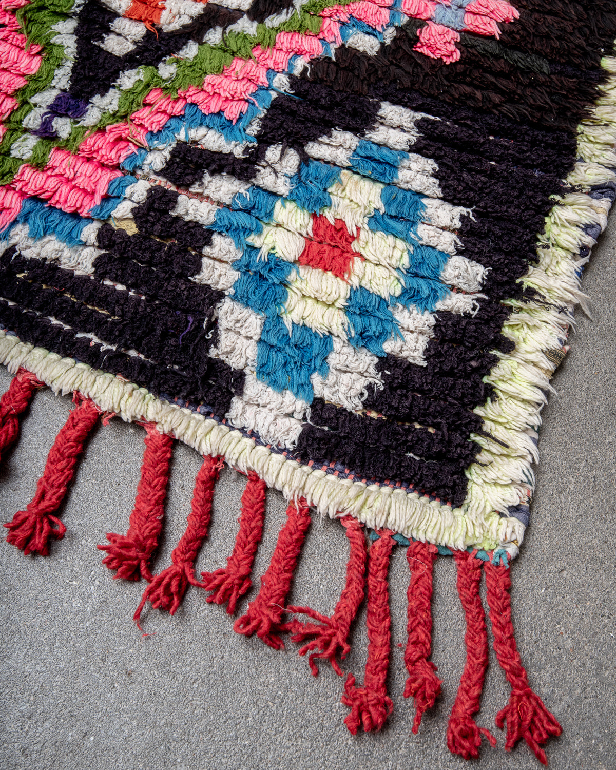 Modern designer vintage handcrafted Berber rug from Morocco. Boucherouite with beautiful colors and patterns.