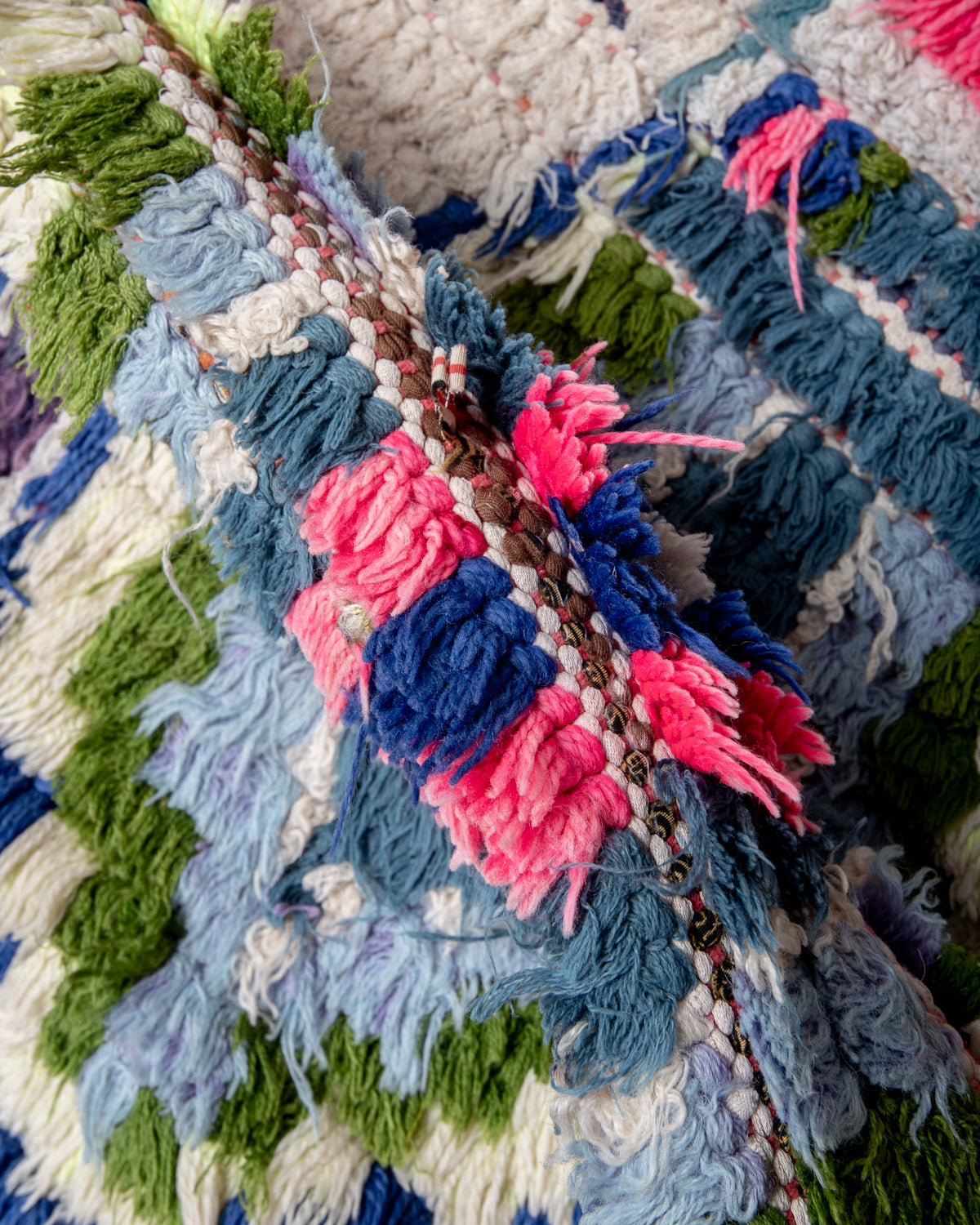 Modern designer vintage handcrafted Berber rug from Morocco. Boucherouite with beautiful colors and patterns.