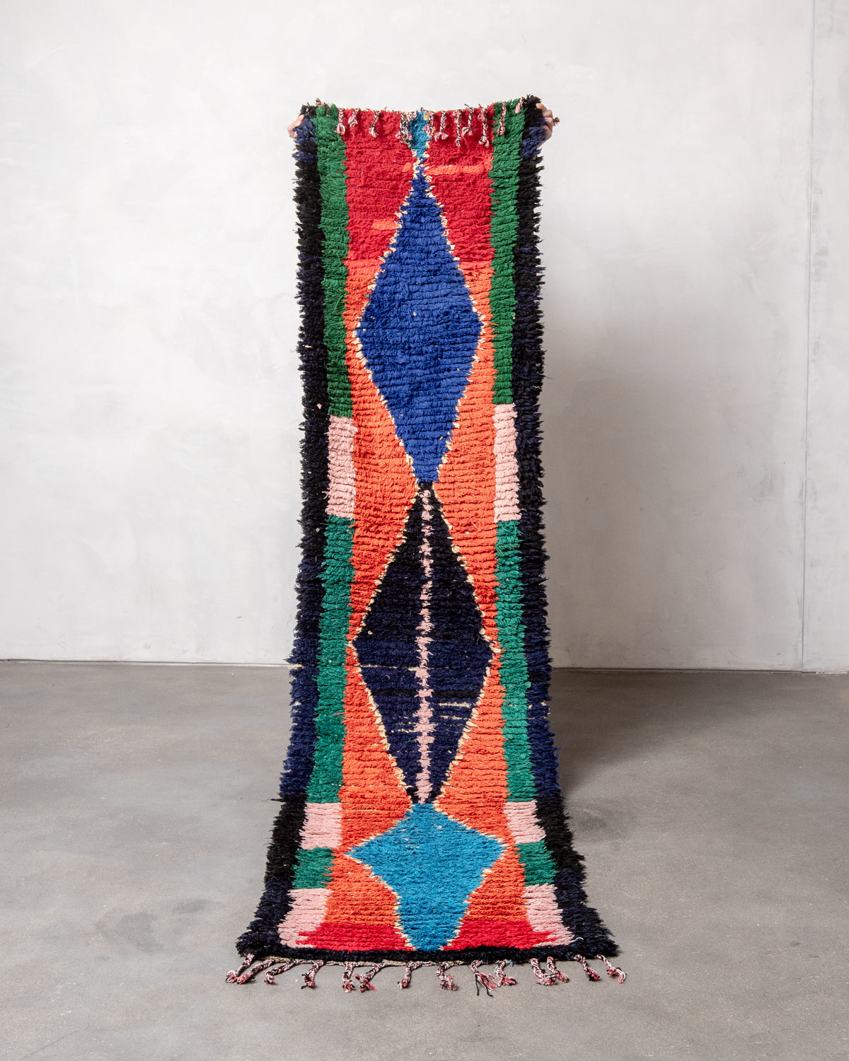 Modern designer vintage handcrafted Berber rug from Morocco. Boucherouite runner rug with beautiful colors and patterns.