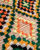 Modern designer vintage handcrafted Berber rug from Morocco. Boucherouite runner rug with beautiful colors and patterns.
