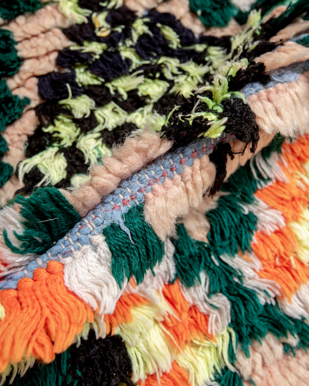 Modern designer vintage handcrafted Berber rug from Morocco. Boucherouite runner rug with beautiful colors and patterns.