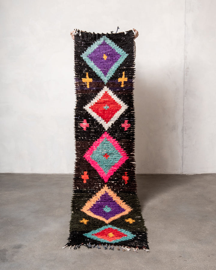 Modern designer vintage handcrafted Berber rug from Morocco. Boucherouite runner rug with beautiful colors and patterns.
