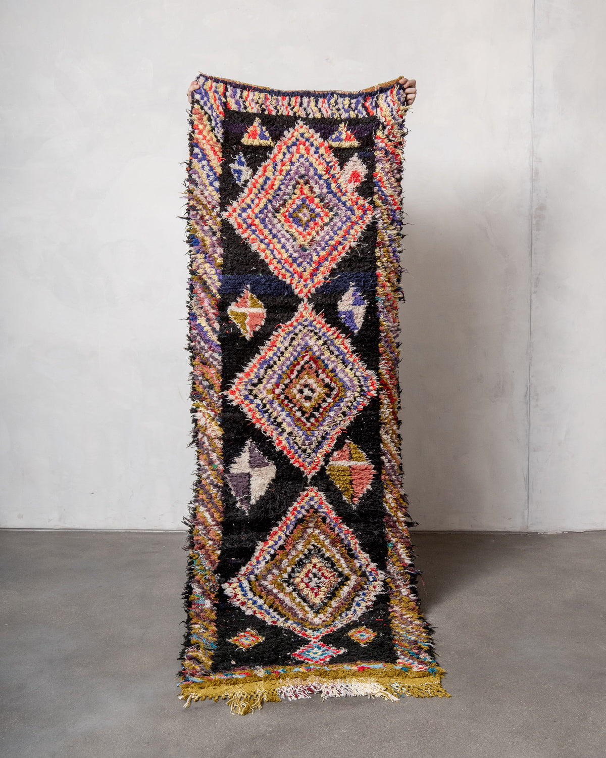 Modern designer vintage handcrafted Berber rug from Morocco. Boucherouite runner rug with beautiful colors and patterns.