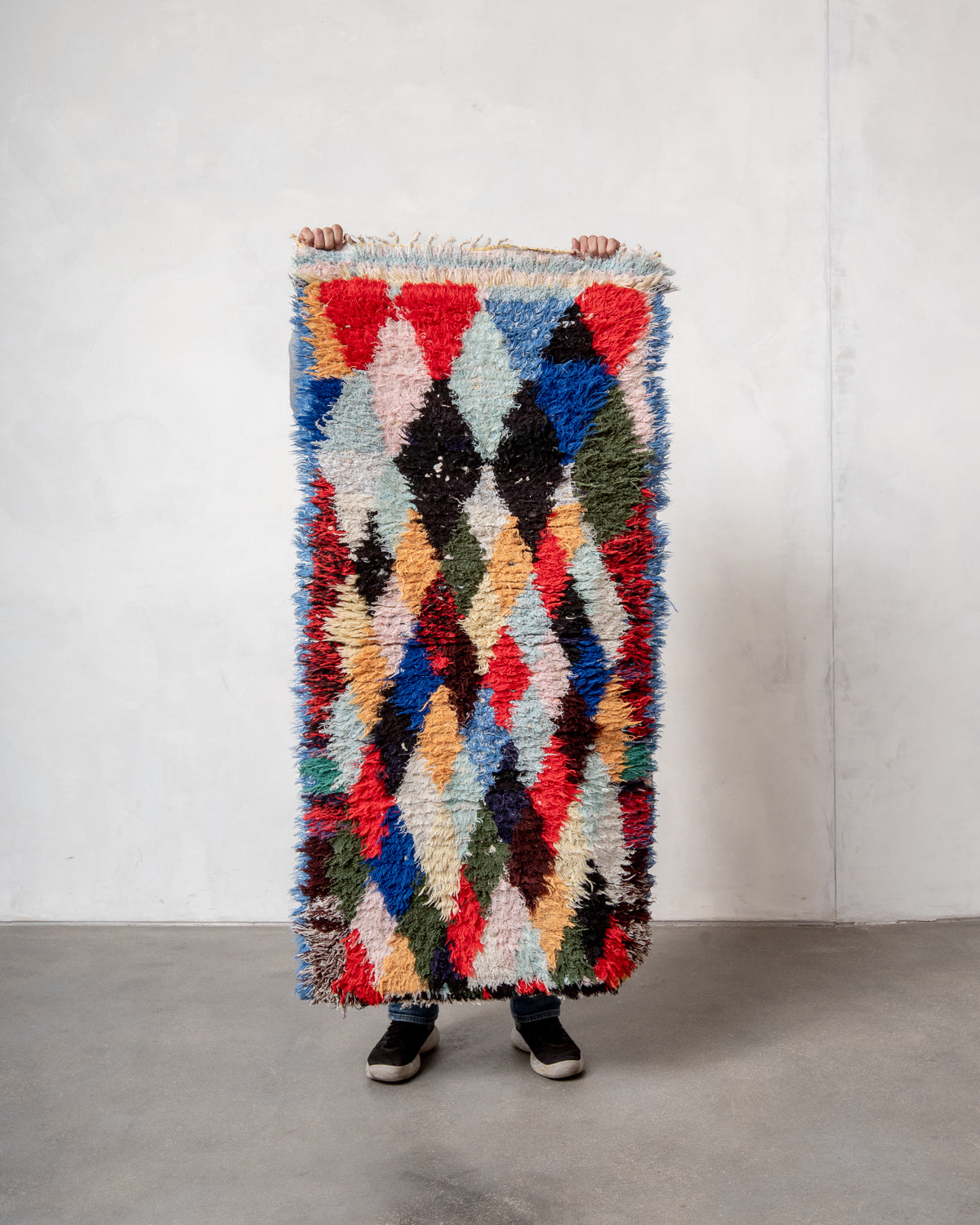 Modern designer vintage handcrafted Berber rug from Morocco. Boucherouite with beautiful colors and patterns.