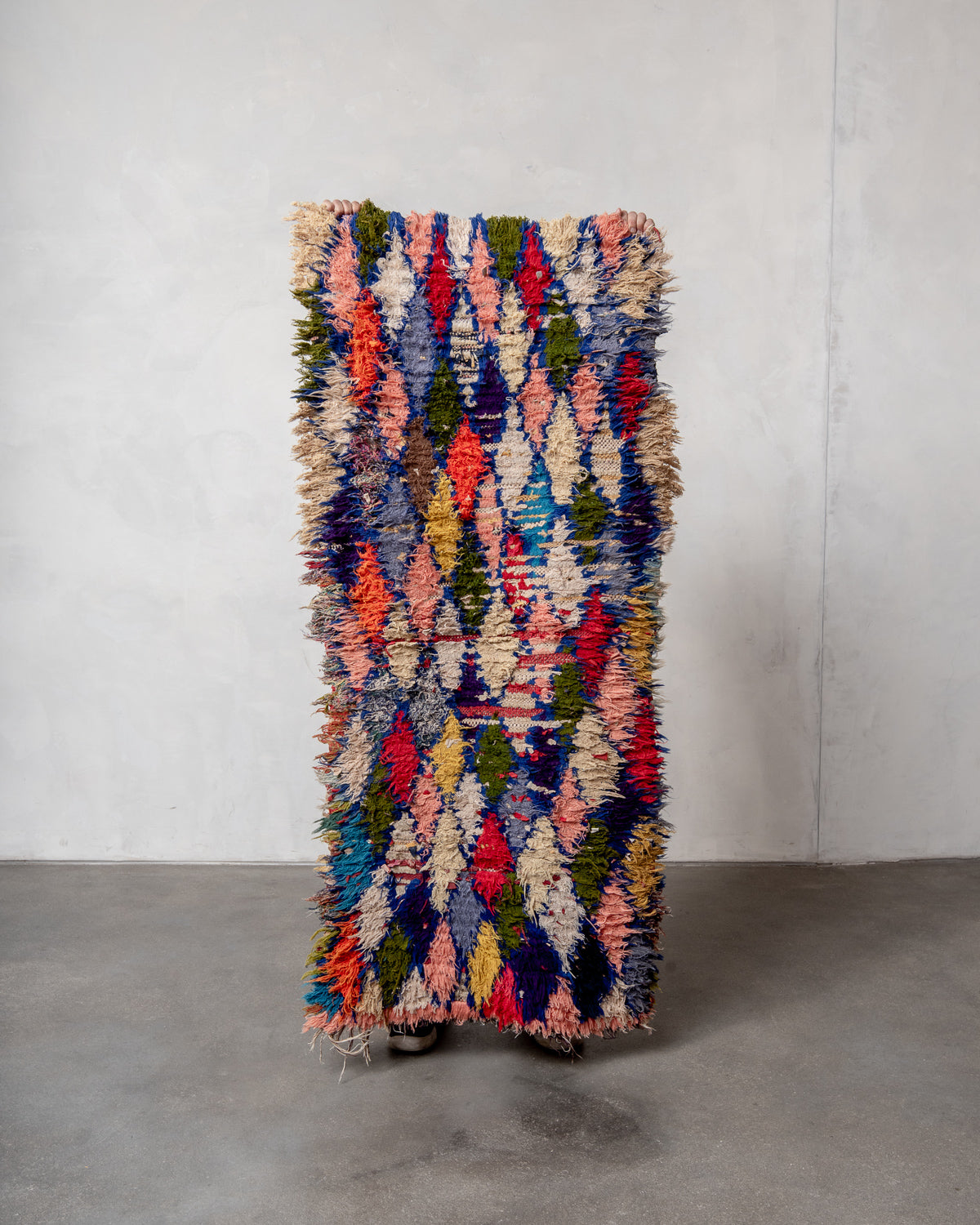 Modern designer vintage handcrafted Berber rug from Morocco. Boucherouite with beautiful colors and patterns.