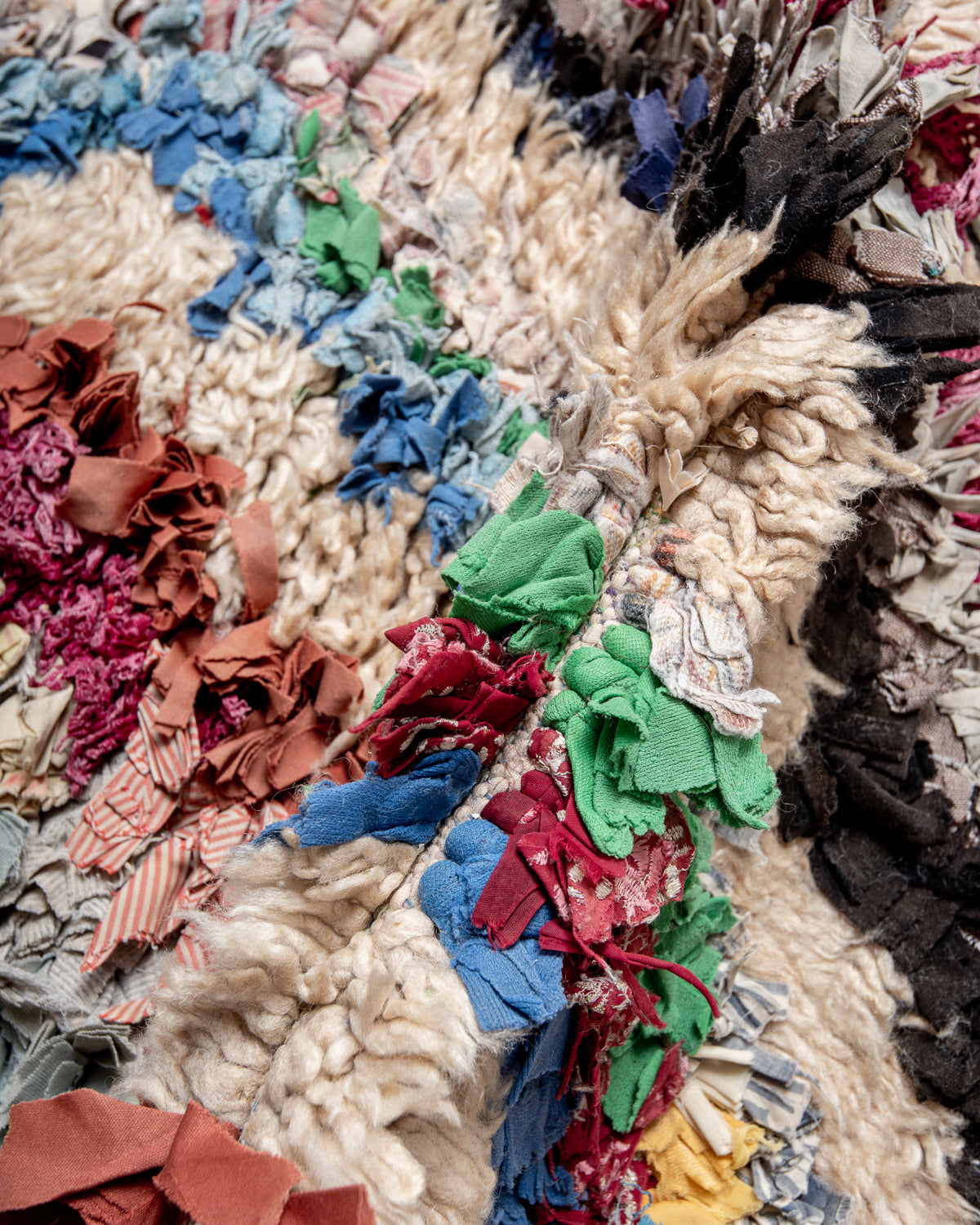 Modern designer vintage handcrafted Berber rug from Morocco. Boucherouite with beautiful colors and patterns.