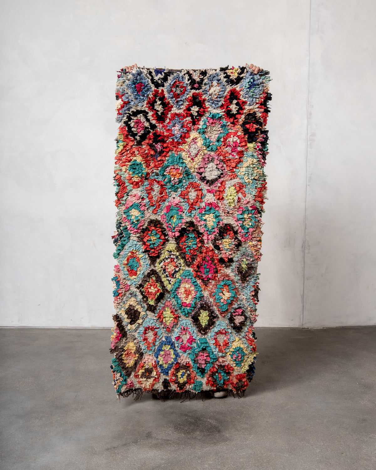 Modern designer vintage handcrafted Berber rug from Morocco. Boucherouite with beautiful colors and patterns.