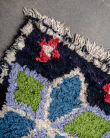 Modern designer vintage handcrafted Berber rug from Morocco. Boucherouite with beautiful colors and patterns.