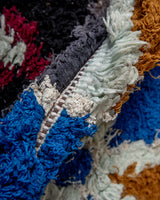 Modern designer vintage handcrafted Berber rug from Morocco. Boucherouite with beautiful colors and patterns.