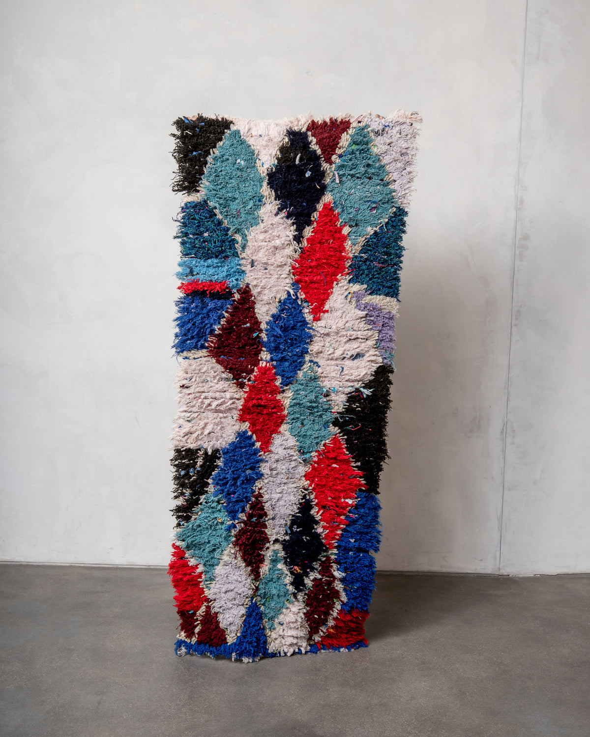 Modern designer vintage handcrafted Berber rug from Morocco. Boucherouite runner rug with beautiful colors and patterns.