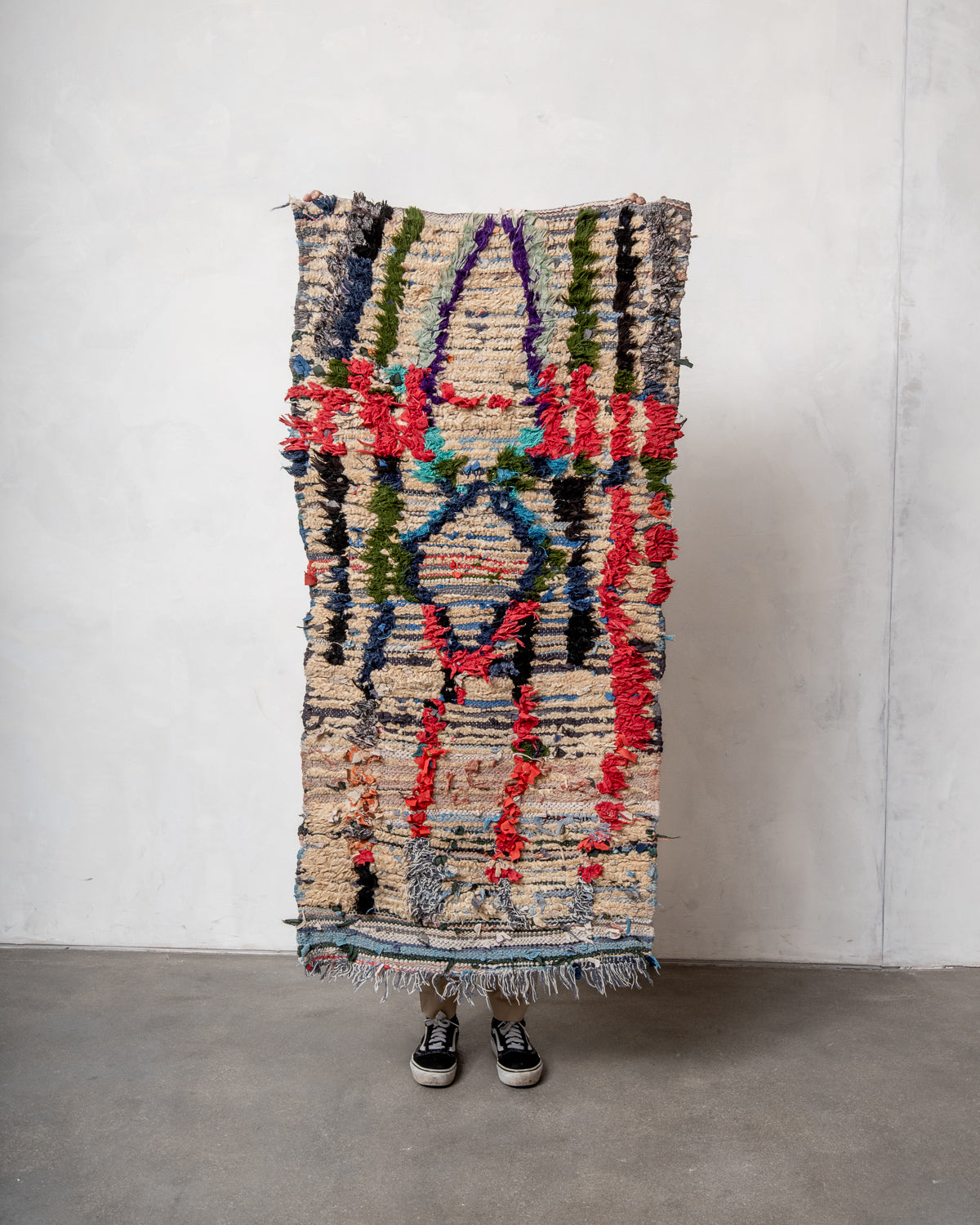 Modern designer vintage handcrafted Berber rug from Morocco. Boucherouite runner rug with beautiful colors and patterns.