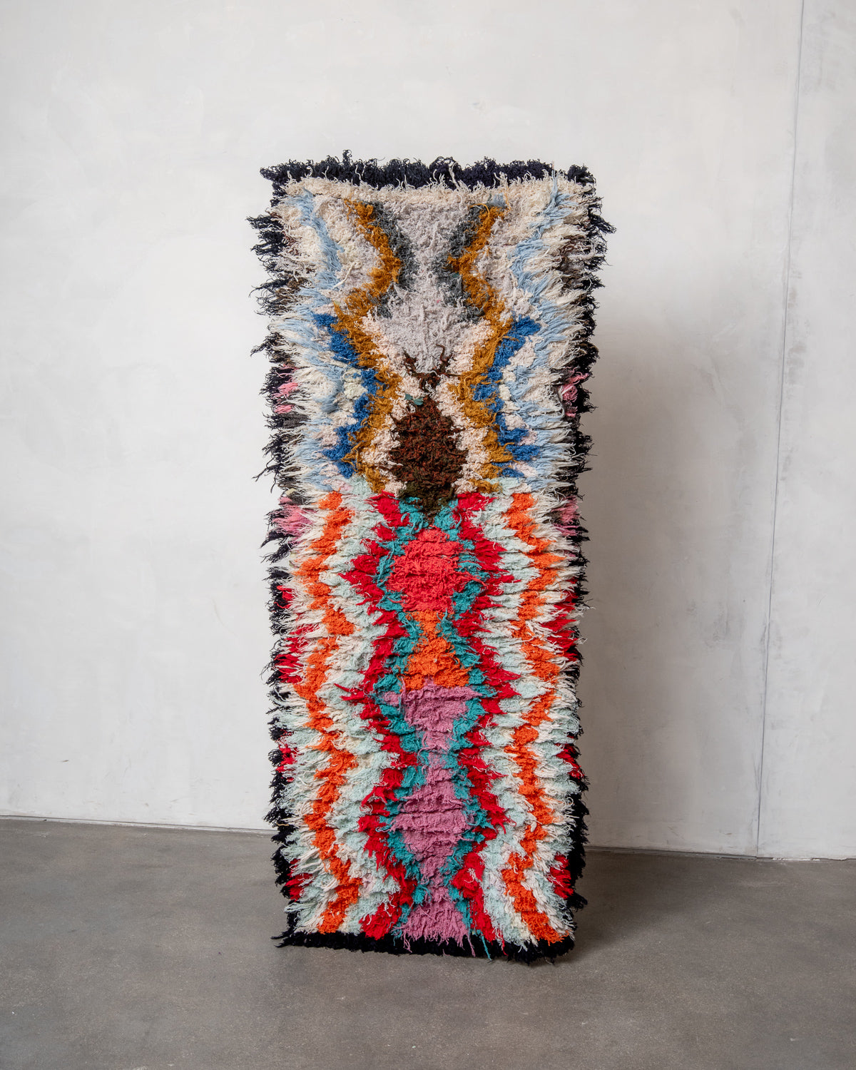 Modern designer vintage handcrafted Berber rug from Morocco. Boucherouite runner rug with beautiful colors and patterns.