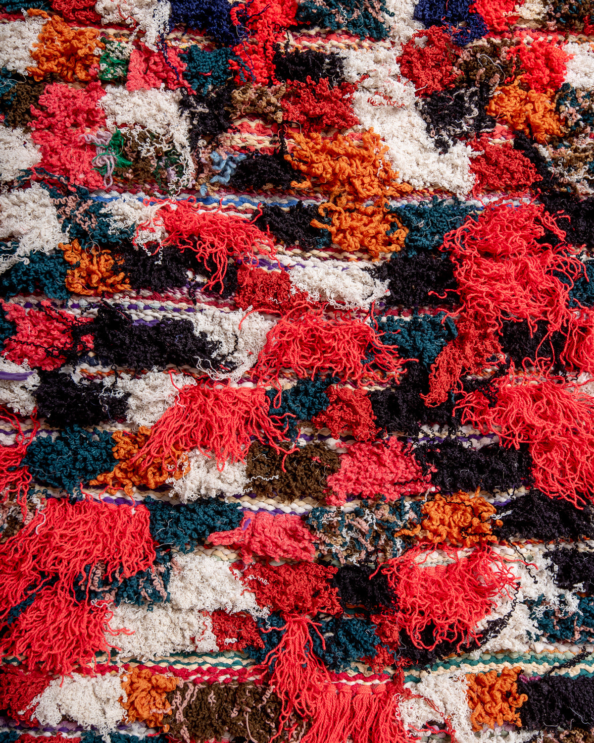 Modern designer vintage handcrafted Berber rug from Morocco. Boucherouite runner rug with beautiful colors and patterns.