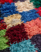 Modern designer vintage handcrafted Berber rug from Morocco. Boucherouite with beautiful colors and patterns.