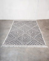 Modern, handcrafted Berber rug from Morocco. Flat-woven Kelim carpet in black and white design. Made of 100% wool.