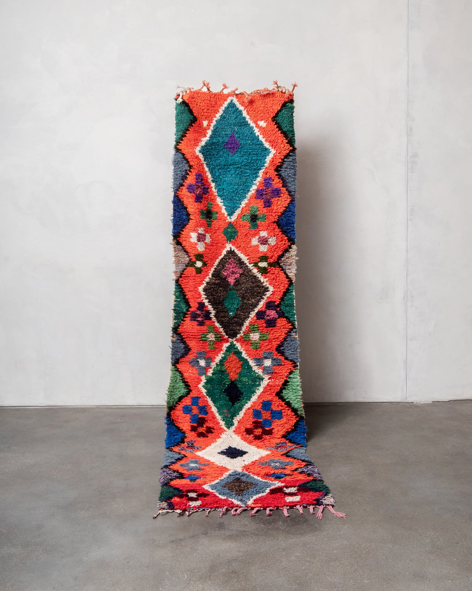 Modern, designer, handcrafted Berber rug from Morocco. Boucherouite carpet with beautiful colours and patterns and fluffy wool texture.